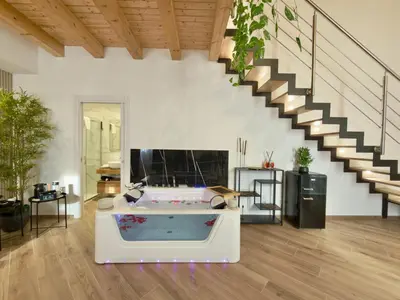 a living room with a couch and a flat screen tv at Montana Suite in Palermo