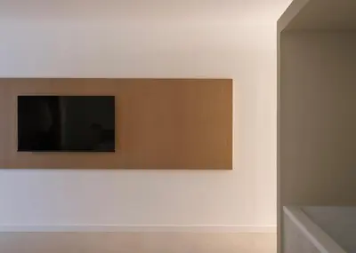 a television on a wall in a room at Aloe -lounge and Jacuzzi- in Palermo