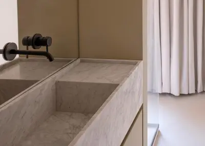 a bathroom with a marble sink with a shower curtain at Aloe -lounge and Jacuzzi- in Palermo