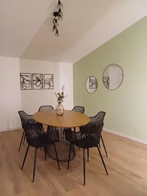 an empty living room with a white door and wood floors at Scrusciu Holiday in Terrasini