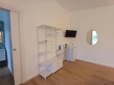 a living room with a couch and a window at Scrusciu Holiday in Terrasini