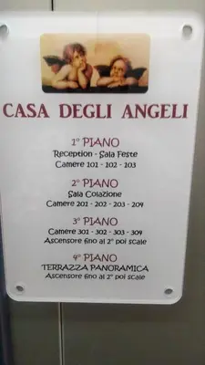 a sign in a bathroom with two people in a bath room at Casa degli Angeli Castellammare del Golfo TP Sicilia in Castellammare del Golfo