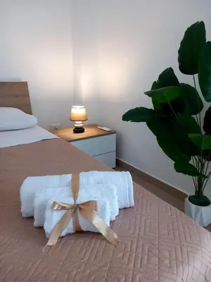 a large white wardrobe in a room with a bed at Blossom House in Isola delle Femmine