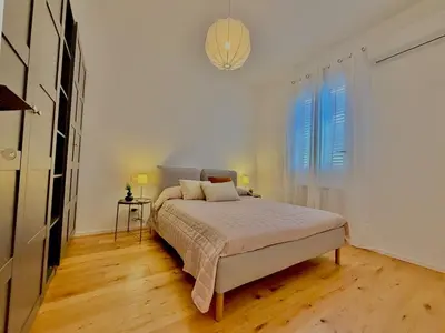 a white bedroom with a bed and a window at Haus Mignon - Bright flat in Palermo Center in Palermo