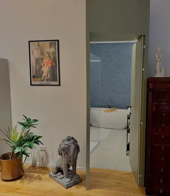a room with a statue of a dog on the floor at Haus Mignon - Bright flat in Palermo Center in Palermo