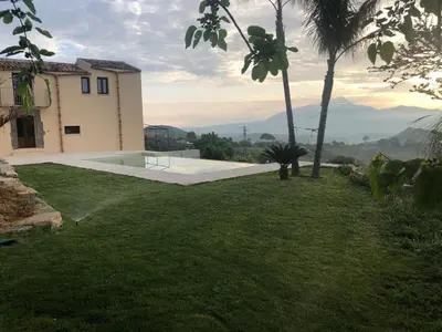a house with a yard with a swimming pool at RossoScirì in Calatafimi