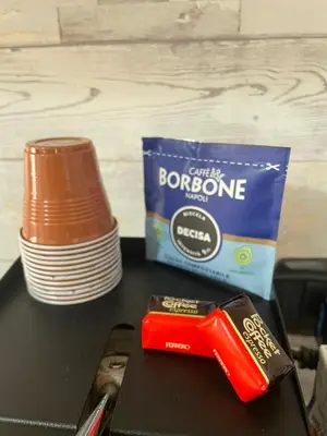 a box of chocolate and a container of coffee bone marrow at Luma Sixty nine in Alcamo