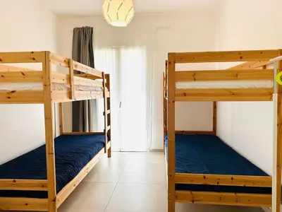 a bedroom with two bunk beds in a room at Casa Battigia in Alcamo
