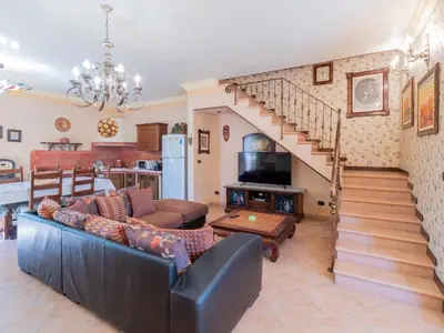 a living room with a couch and a table at Casa San Nicola Trabia Mare in Trabia