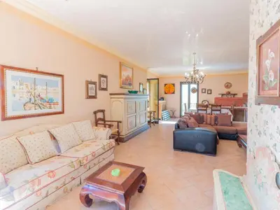 a room with a window and a wooden table at Casa San Nicola Trabia Mare in Trabia