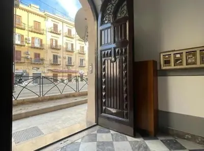 an open door with a view of a building at Central Station Apartaments Casa Vacanze in Palermo