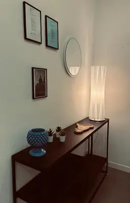 two green vases are sitting on a shelf at Lolli Guest House in Palermo
