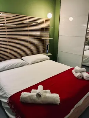 a bathroom with a shower and a sink and a toilet at Lolli Guest House in Palermo