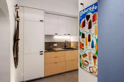 a kitchen with white cabinets and a sink at PAT Amazing & Charm cozy apt in Palermo