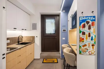 a kitchen with a refrigerator next to a sink at PAT Amazing & Charm cozy apt in Palermo