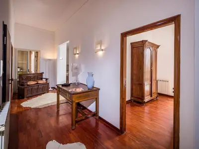 a living room with a table and a mirror at Apartment Wohnung dei Mori in Terrasini by Interhome in Terrasini