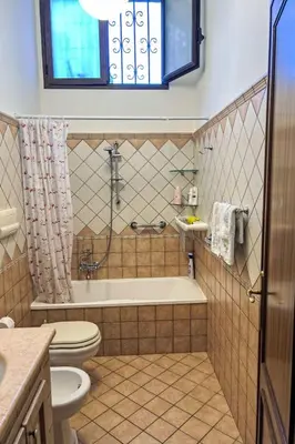 a bathroom with a tub and a toilet and a sink at Apartment Sea Living Sicilia Apartment by Interhome in Santa Flavia