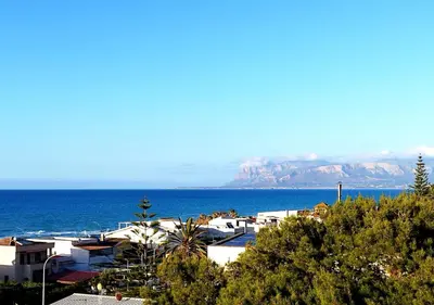 a view of the ocean and a town with houses at Alessandra in Alcamo