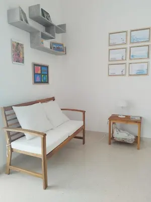 a living room with a bench and a table at Alessandra in Alcamo