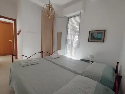 a bedroom with a bed with two towels on it at Alessandra in Alcamo