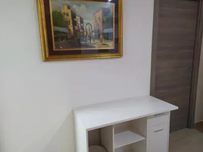 a white desk in a room with a painting on the wall at Heidi's home in Villabate