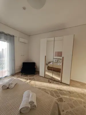 a bedroom with a bed and a large mirror at Kennedy 100 in Capaci