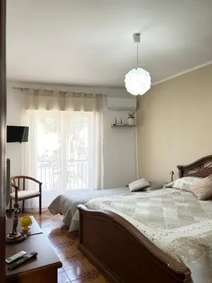 a bedroom with a large bed and a window at La Casa del Sole in Corleone