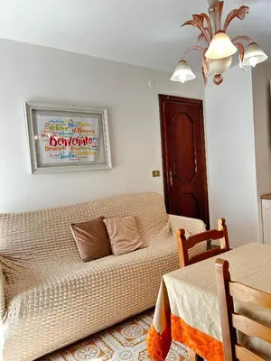a living room with a couch and a table at La Casa del Sole in Corleone