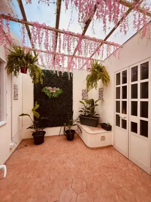 a room with potted plants on the wall at Villareale28 suite in Palermo