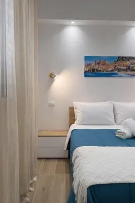 a bedroom with a bed with a stuffed animal on it at S&L Central Apartment in Palermo