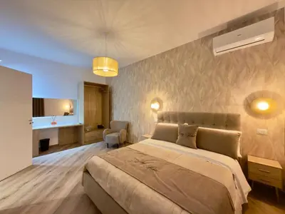 a bedroom with a large bed in a room at Gemy House in Palermo