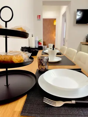 a table with plates of food on top of it at Gemy House in Palermo