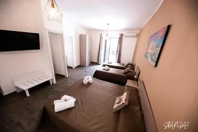 a living room with two couches and a couch at Terra Sicula Ballaroom in Palermo