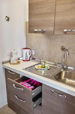 a kitchen with a sink and a counter top at Apartment Papyri in Palermo