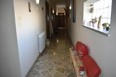 a hallway with a red couch in a room at Framamired in Palermo