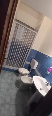 a bathroom with two toilets and a sink at Framamired in Palermo