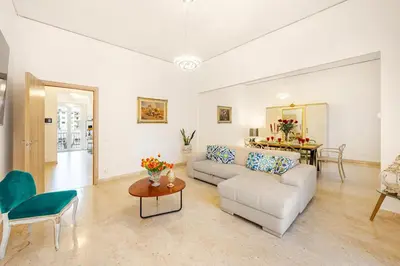 a living room with a couch and a table at Angelica holiday home in Palermo