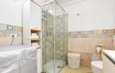 a bathroom with a shower and a toilet at Casa Toledo in Partinico