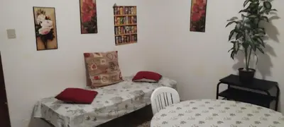 a small room with a table and a small bed at Domus in Palermo