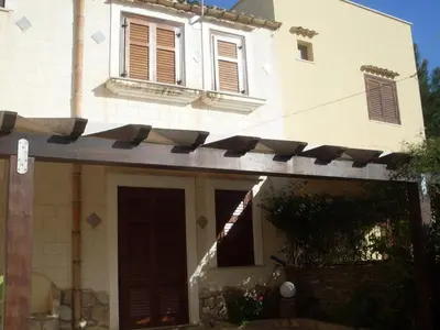 a house with a bunch of solar panels on it at Baglio Fontana in Castelluzzo