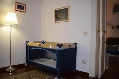 a bed in a room with a lamp at I Pupi Di Belfiore in Palermo