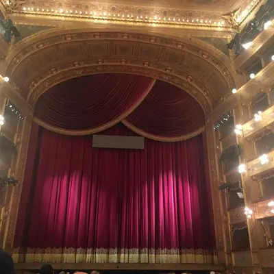 an image of a stage with a red curtain at I Pupi Di Belfiore in Palermo