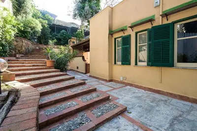 a set of stairs in front of a building at Villa Agave - SeaFront - Pool Kids - BBQ in Santa Flavia