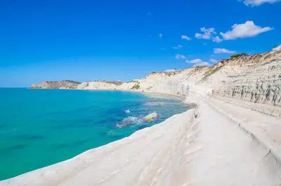 a view of a sandy beach next to the ocean at Villa Agave - SeaFront - Pool Kids - BBQ in Santa Flavia