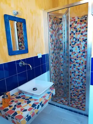 a bathroom with a shower and a sink at Villetta Degli Oleandri in Castellammare del Golfo