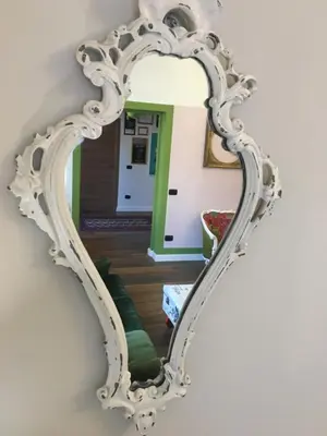a large white mirror hanging on a wall at Cialoma B&B in Palermo