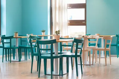 a group of tables and chairs in a restaurant at Residence Itaca in Castellammare del Golfo