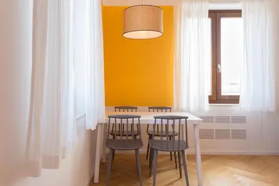 a dining room with a table and four chairs at Residence Itaca in Castellammare del Golfo