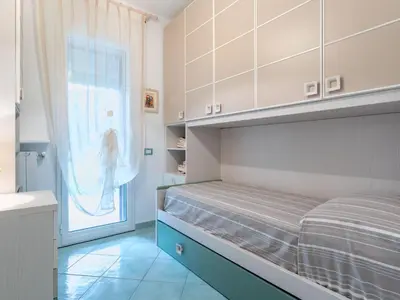a bedroom with a bed and a large window at Villa Jancaliva by Interhome in Cefalù