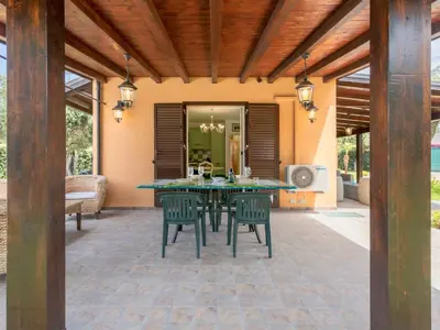 an outdoor patio with a table and chairs at Villa Jancaliva by Interhome in Cefalù